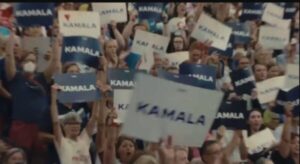 Kamala-signs-scaled.jpg